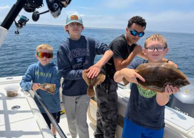 jackie lu charters - kids with their catch!